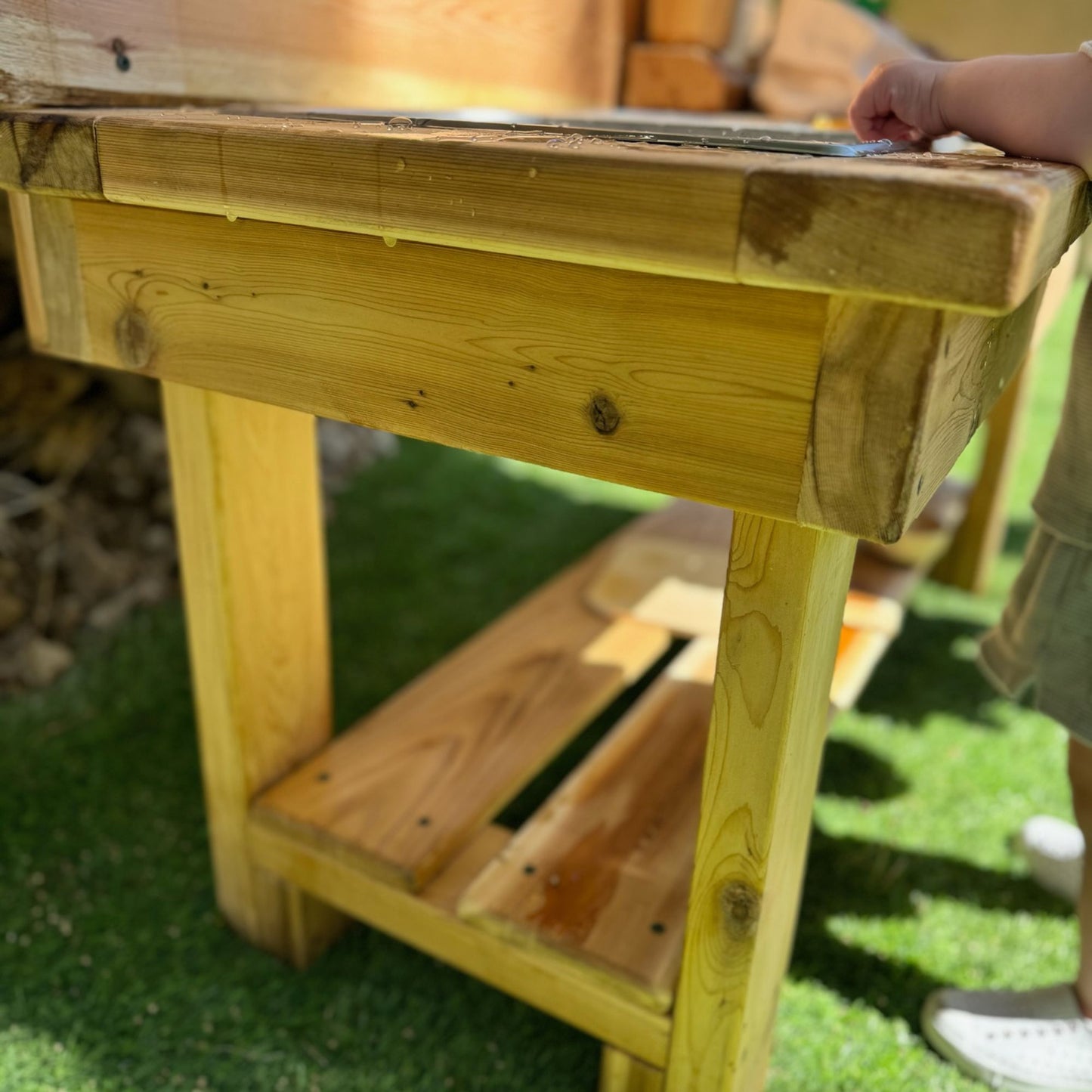 Kids exploring with a mud kitchen