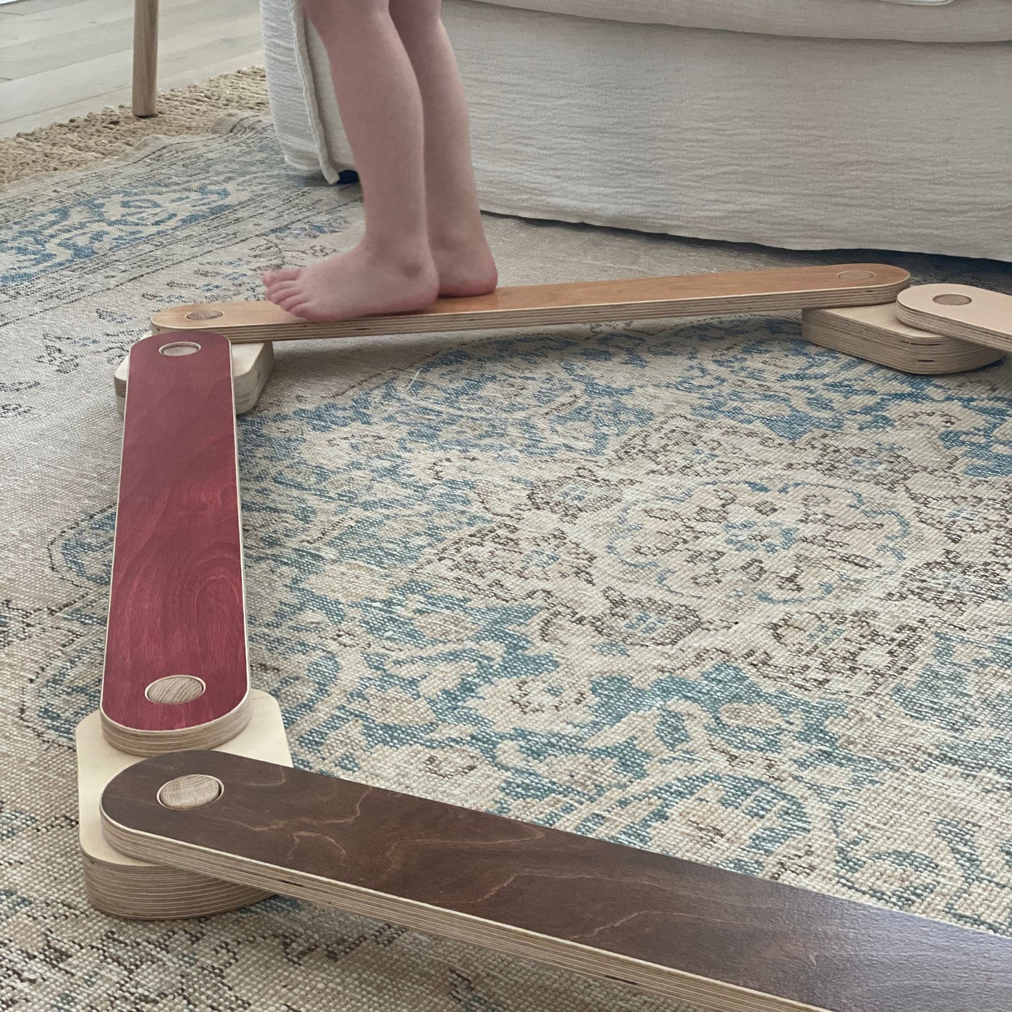 Child focused on balancing on a beam