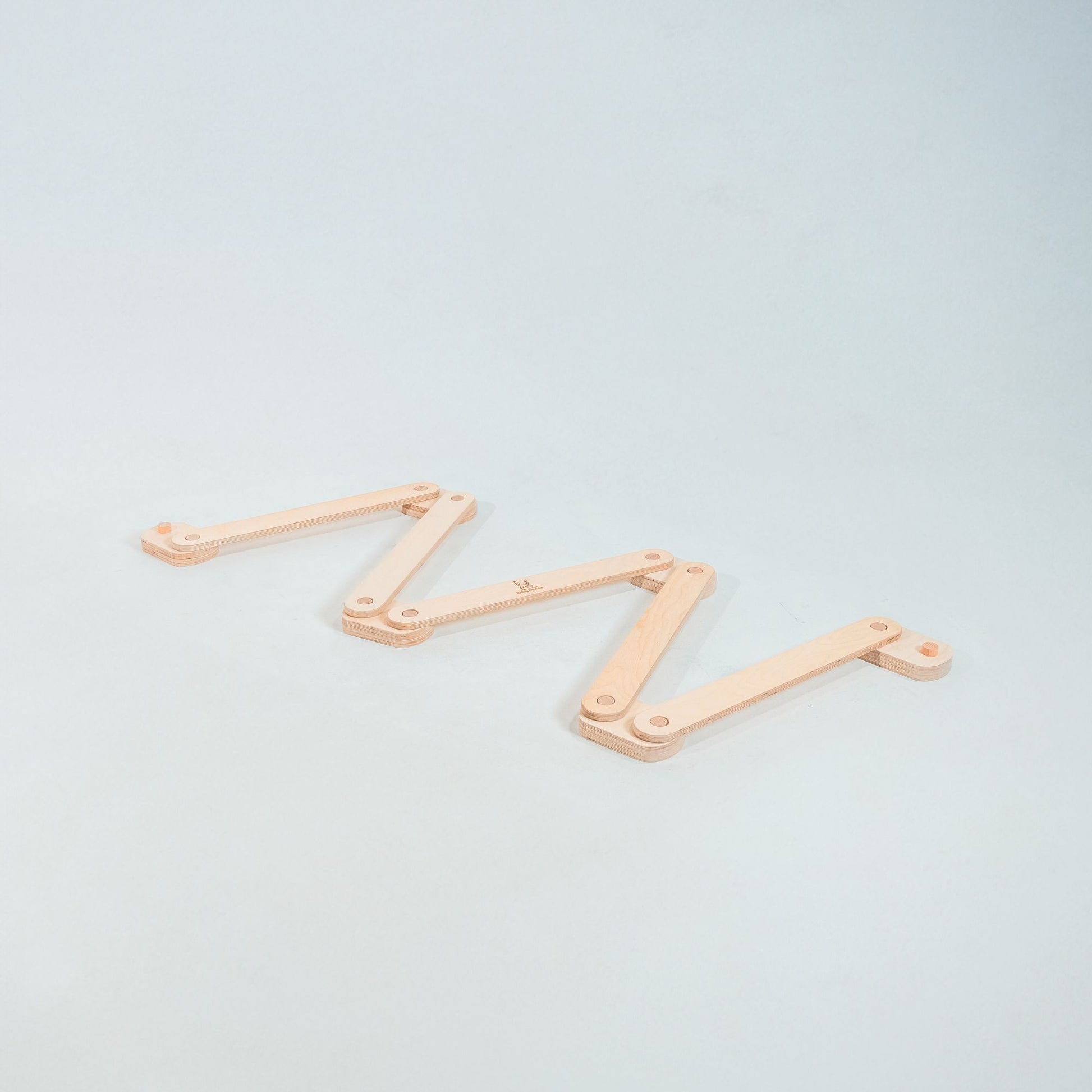 Child carefully balancing on a beam