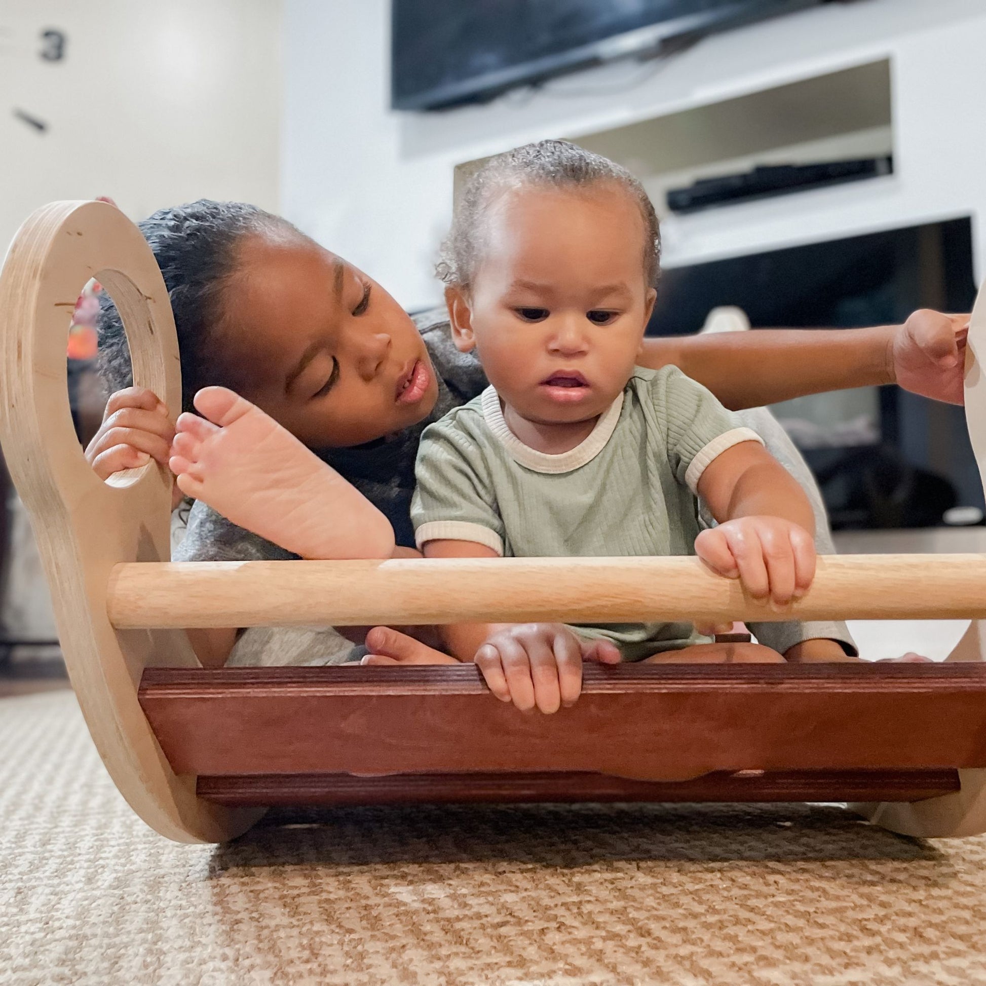 Child's physical development with a rocker climber arch