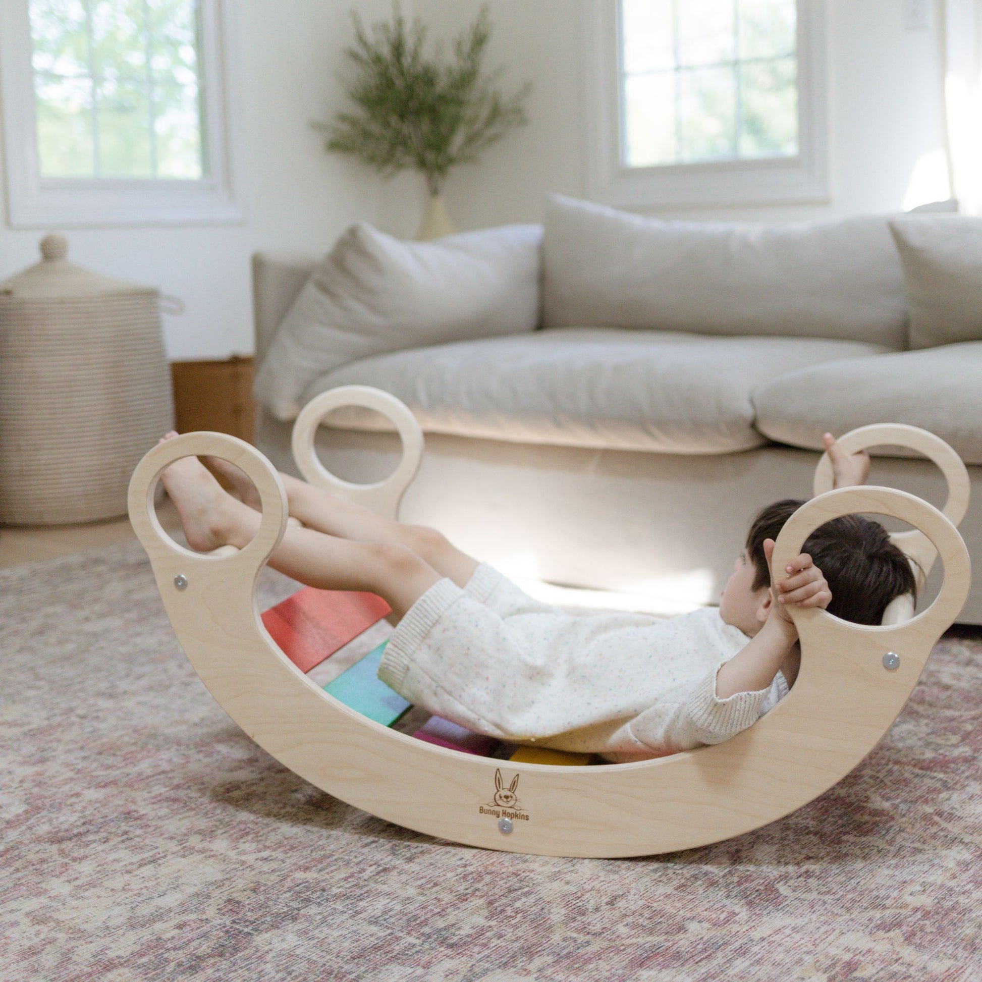 Kids enjoying a rocker climber arch